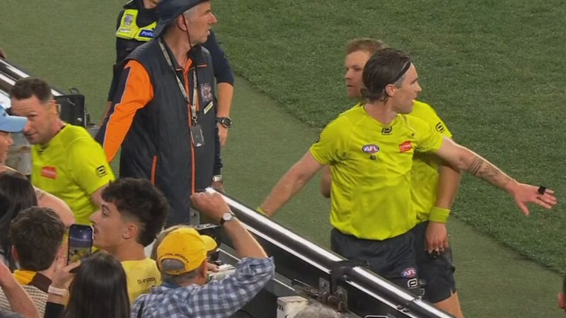 Umpires pelted with bottles leaving the field