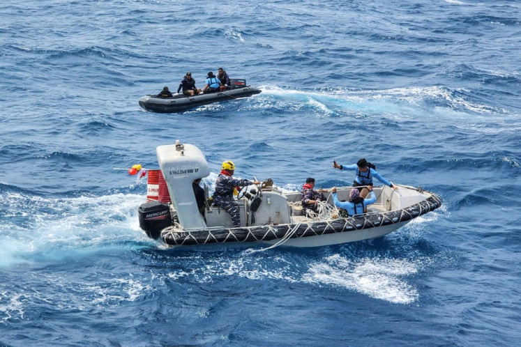 Rescuers extend search for dozens still missing in Java Sea ferry accident