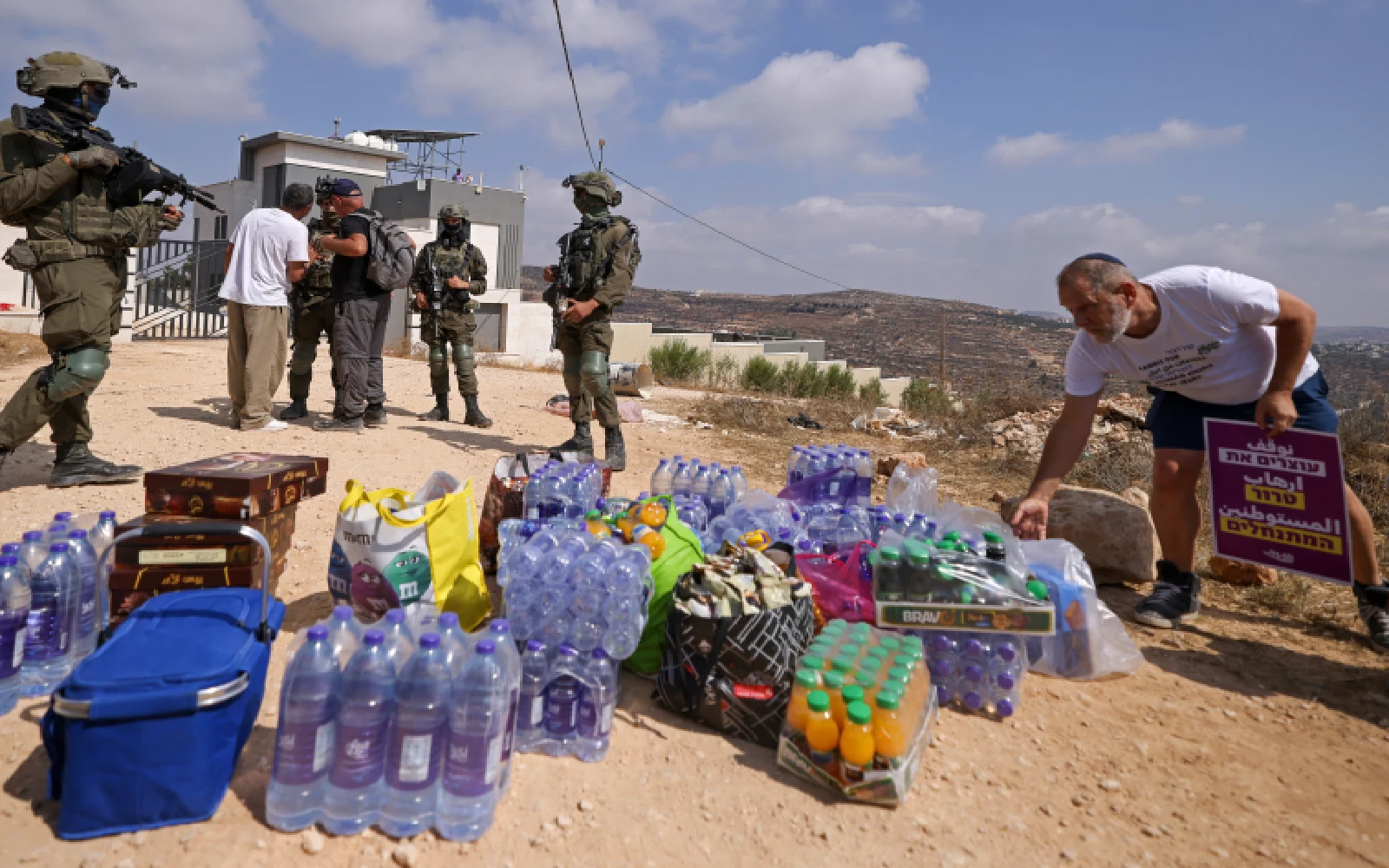 Activists try to get supplies to Palestinians besieged by settlers