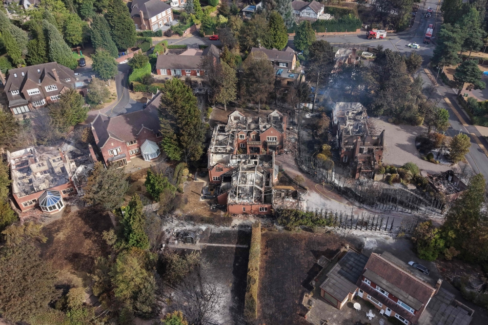 UK firefighters battle wildfires as heatwave leaves homes scorched, thousands at risk