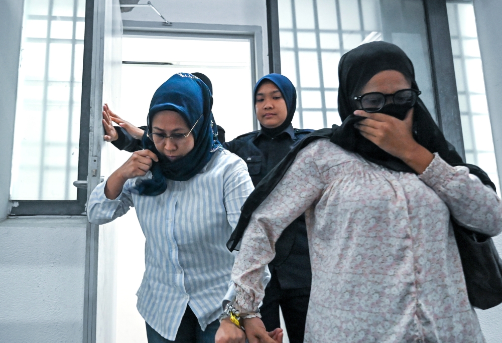 Two women in dock for allegedly duping retiree in Perak out of RM120,000 over fake tax arrears