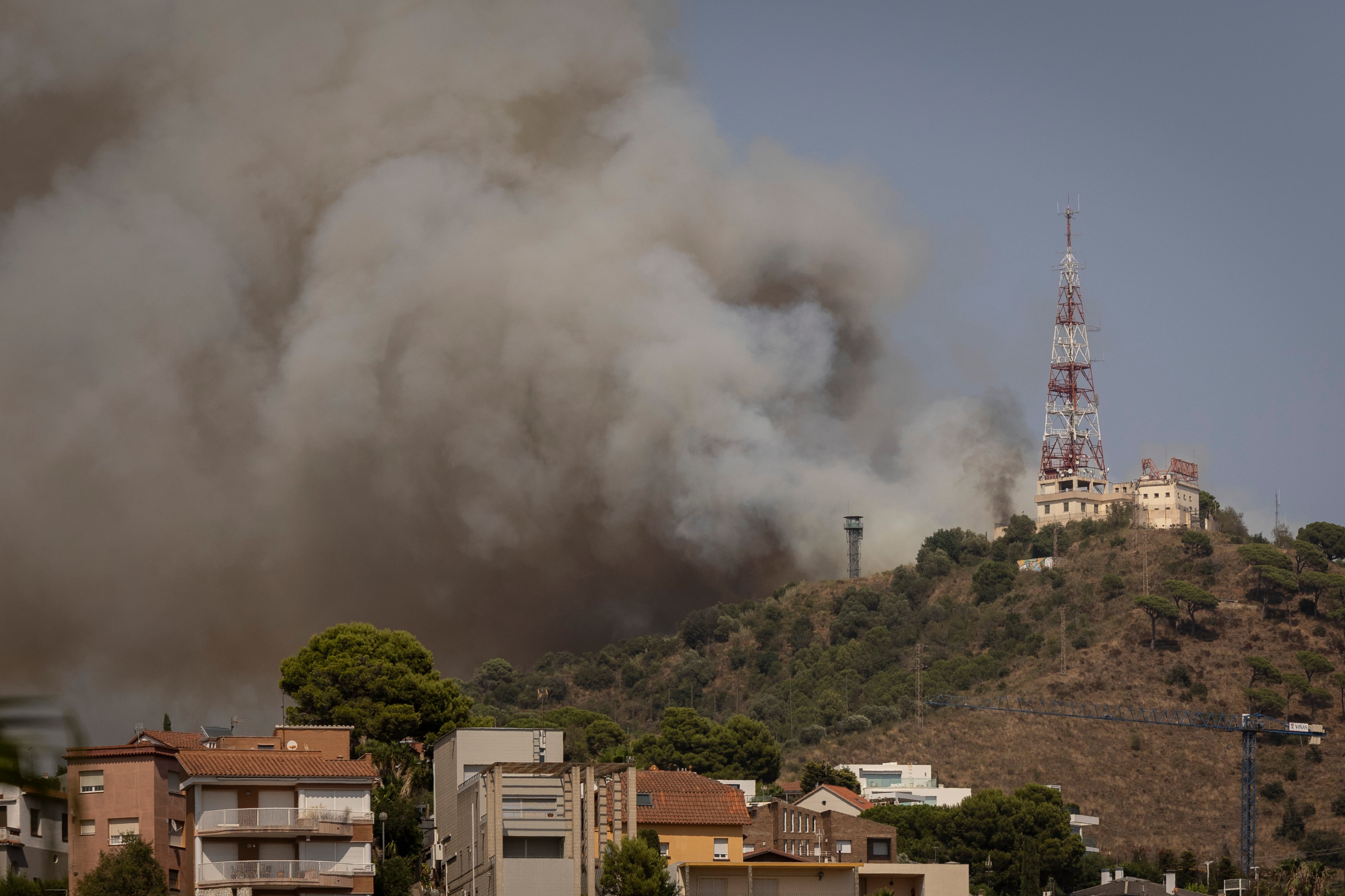 Firefighters work on a fire in the Collserola park (Barcelona)