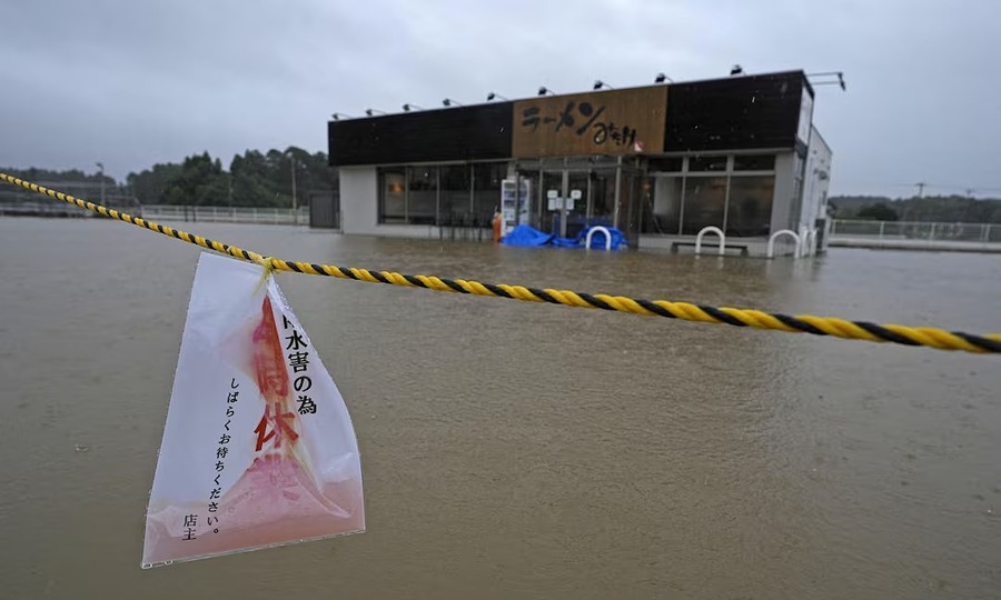 Typhoon cuts short one of the world's biggest video game fairs, grounds hundreds of flights in Japan
