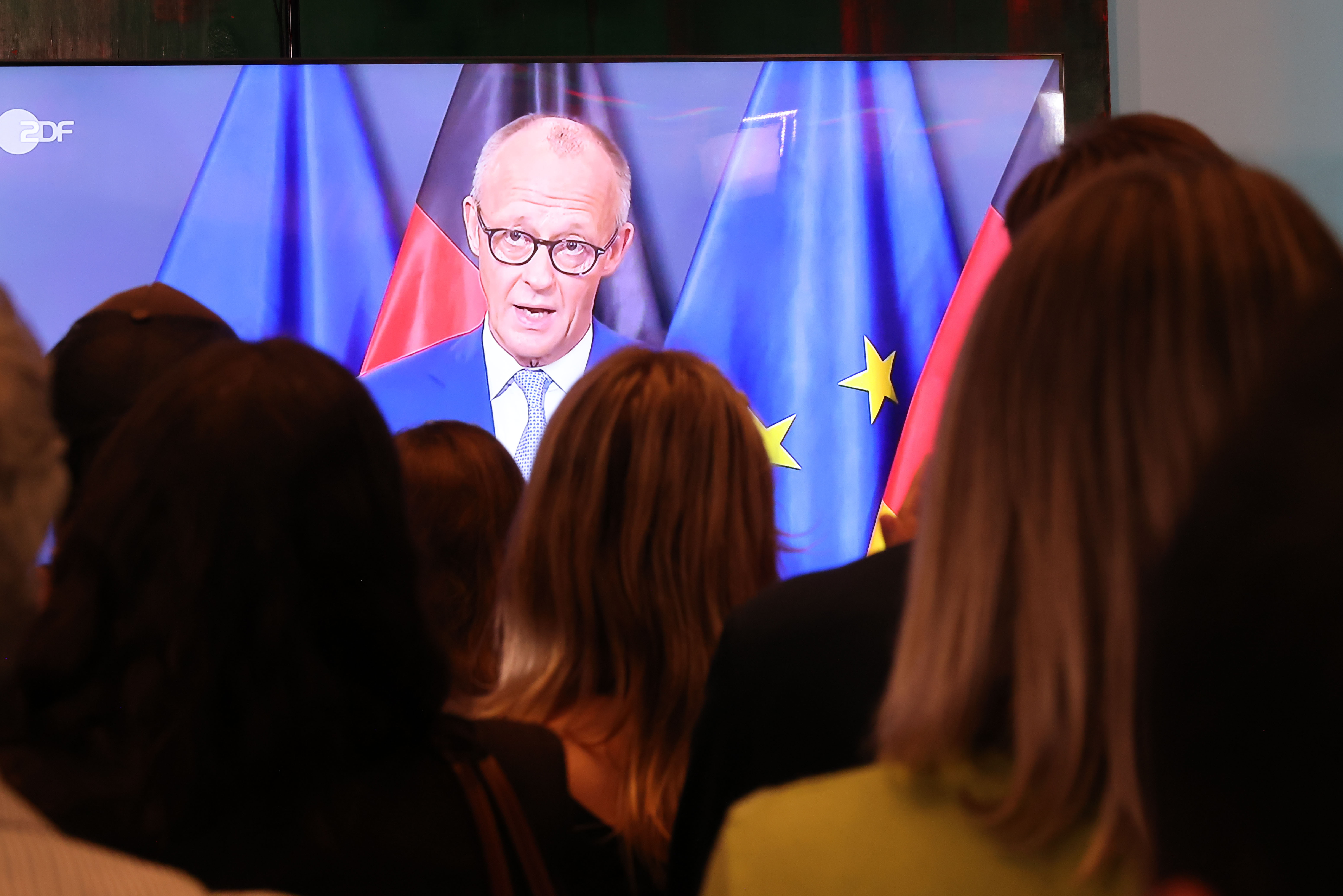 German chancellor stands his ground after his party loses in state elections