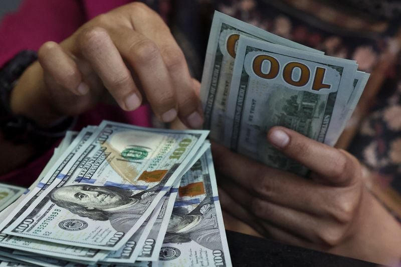 Dollar holds near 2-month high as markets weigh rate hikes, Iran diplomacy