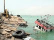 Yemen government says Houthi missiles kill four civilians in port city