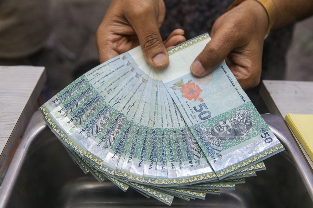 Ringgit opens lower against US dollar as Fed rate hike bets lift greenback