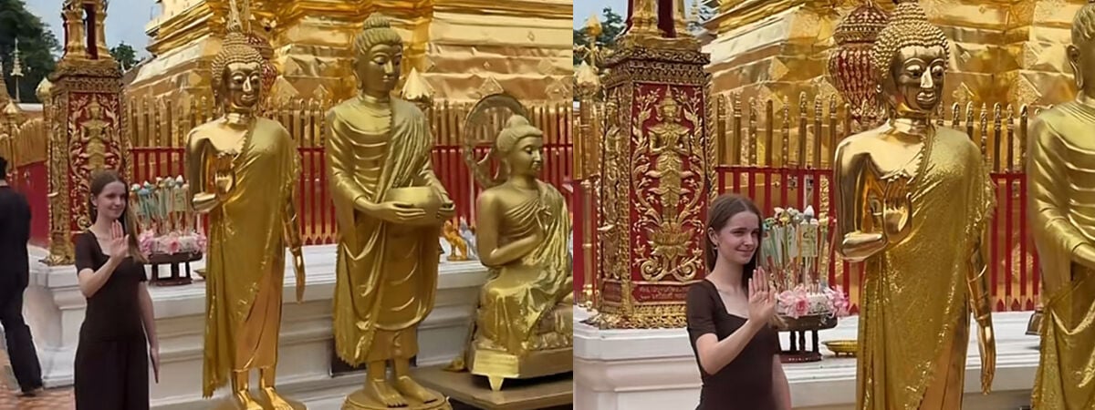 Tourist poses beside a Buddha at Doi Suthep and accidentally nails the pose